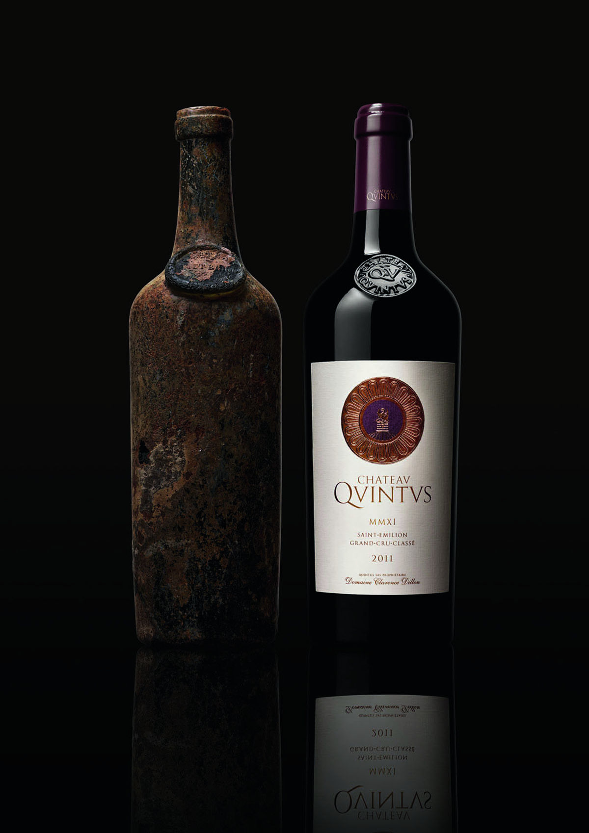 A contemporary bottle of wine and an antique bottle of wine