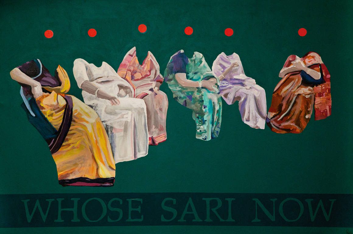 different colour saris on a green back ground