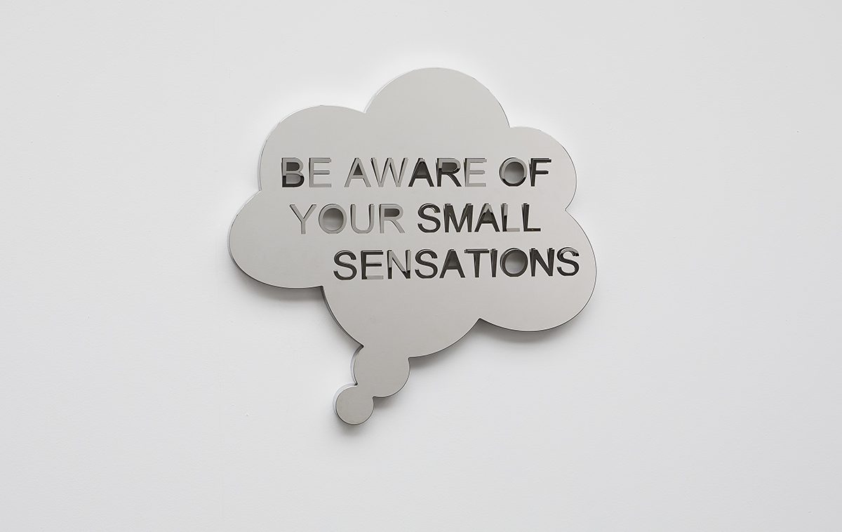 A mirror speech bubble that says 'Be aware of your small sensations"
