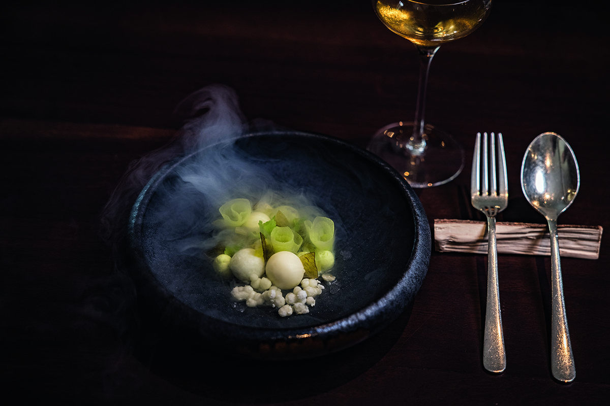 food steaming with fork and spoon on right
