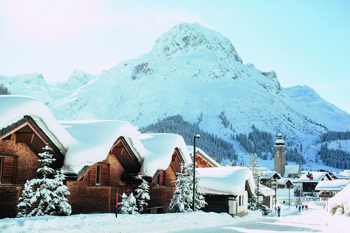 houses in line covered in snow 