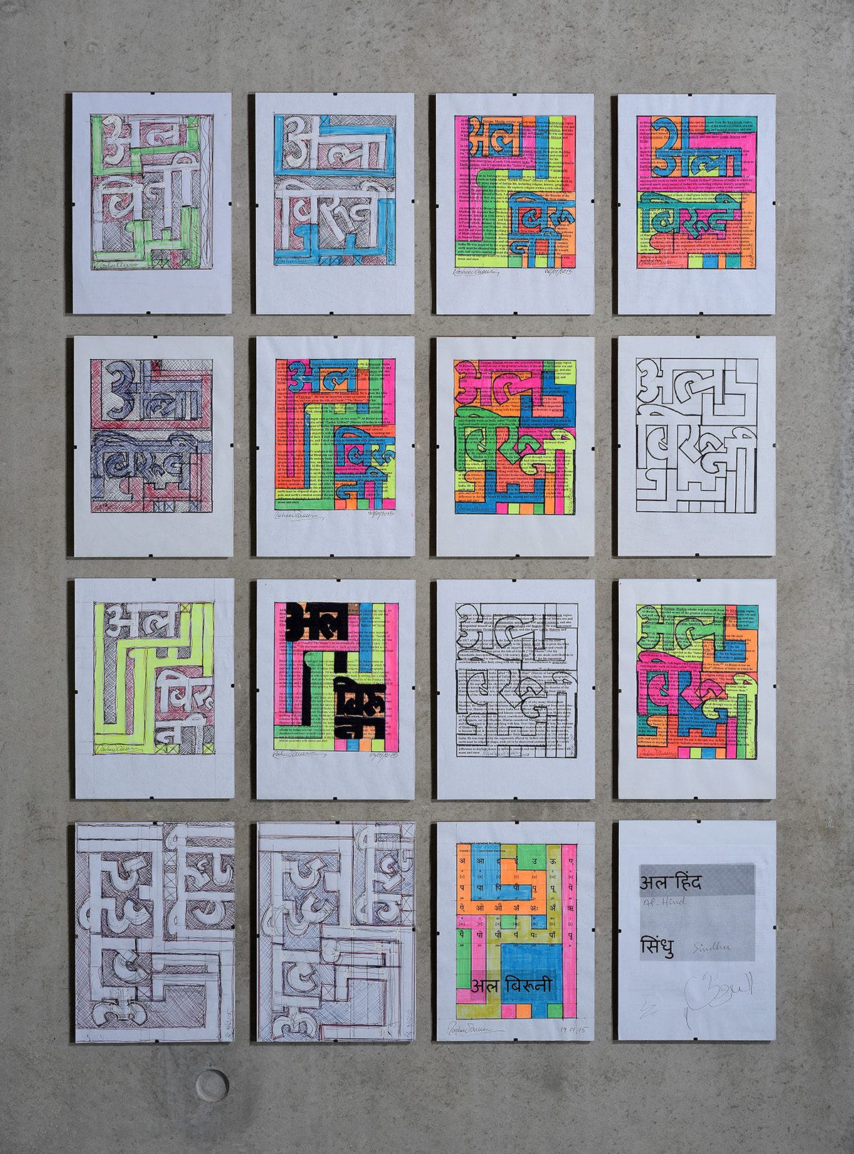 pieces of paper with colourful drawings stuck on a wall