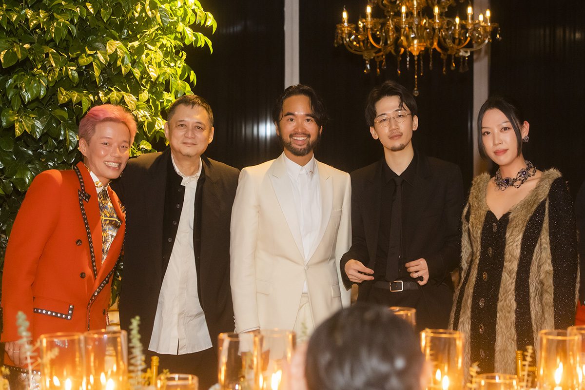 people standing for a photo at a party