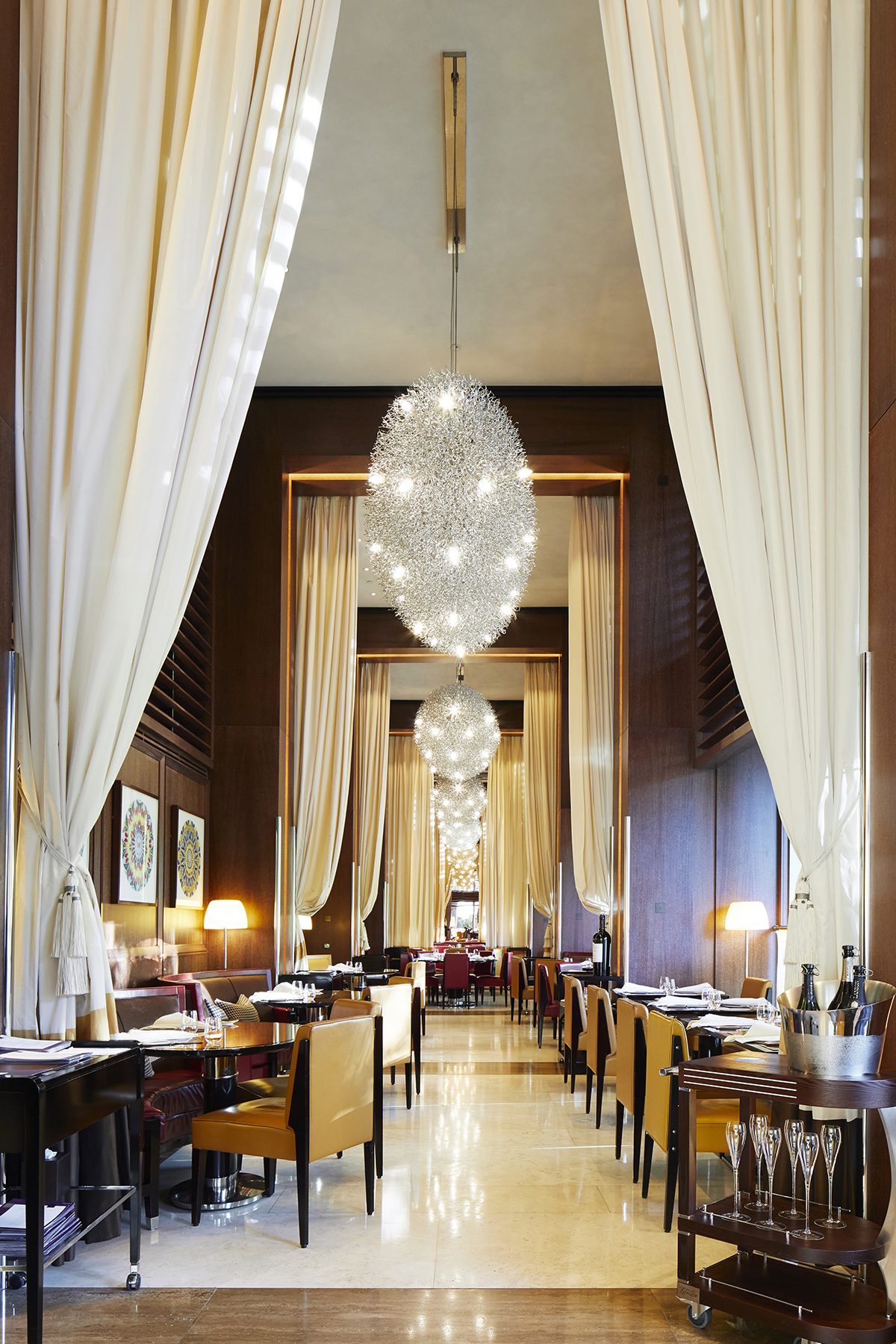 A dining room with white curtains