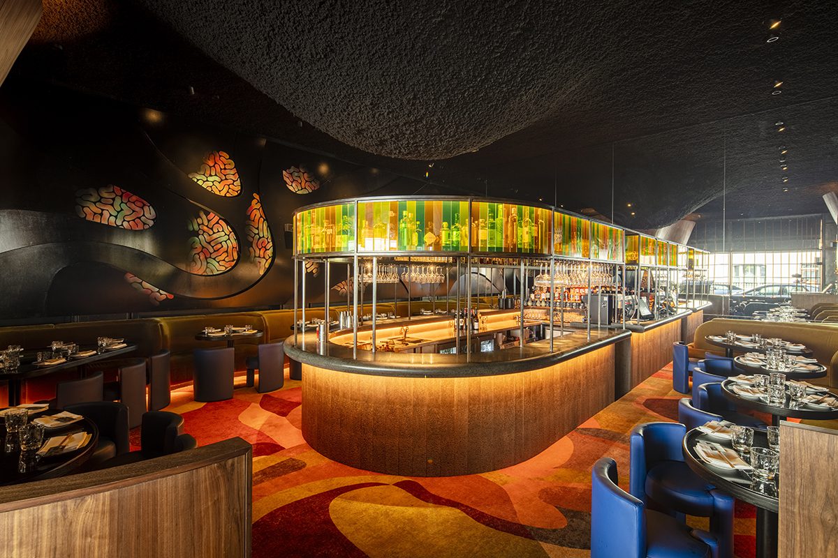 A bar with coloured green and orange lights