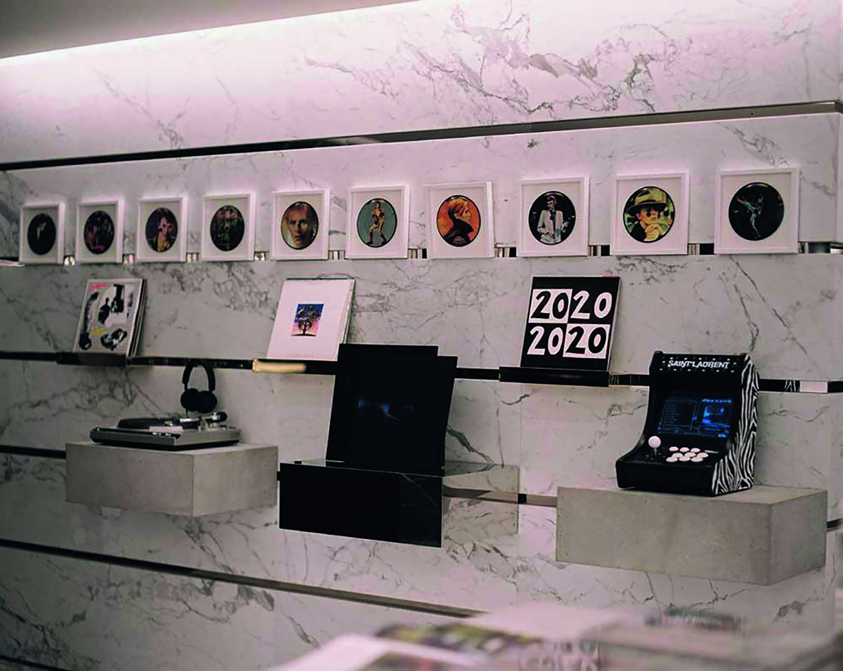 record players and CD Vinyls stacked up on a marble wall