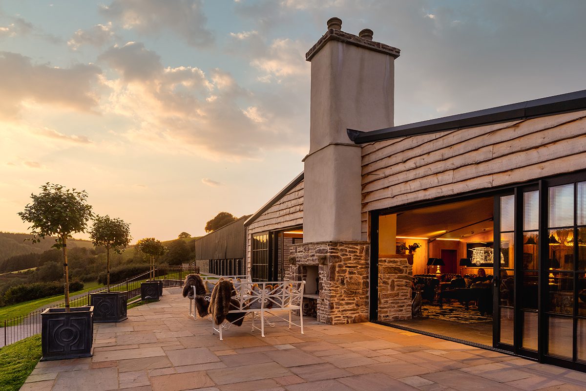 a stone house with an outdoor patio