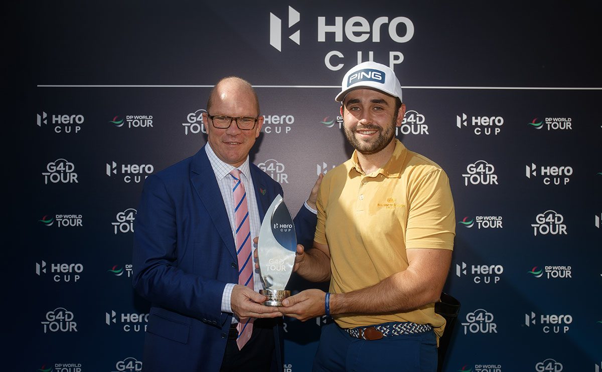 Two men holding a trophy