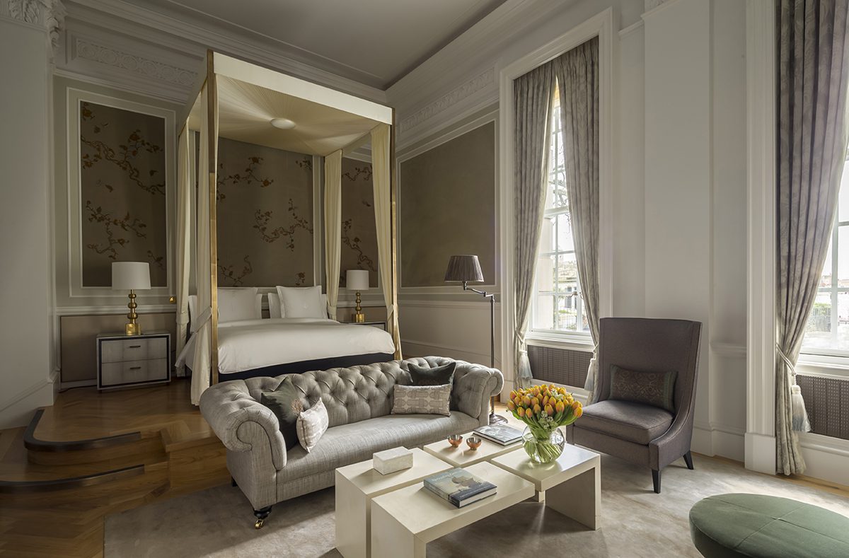 A bedroom with beige and grey interiors