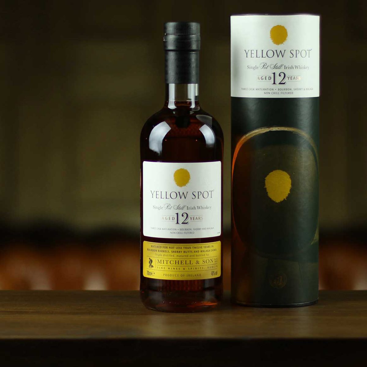 A bottle with a yellow and white label