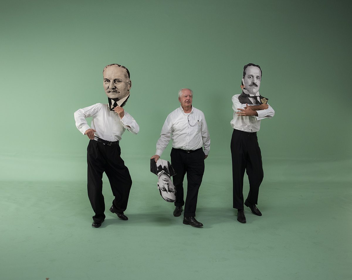 Two giant men walking with a man in between