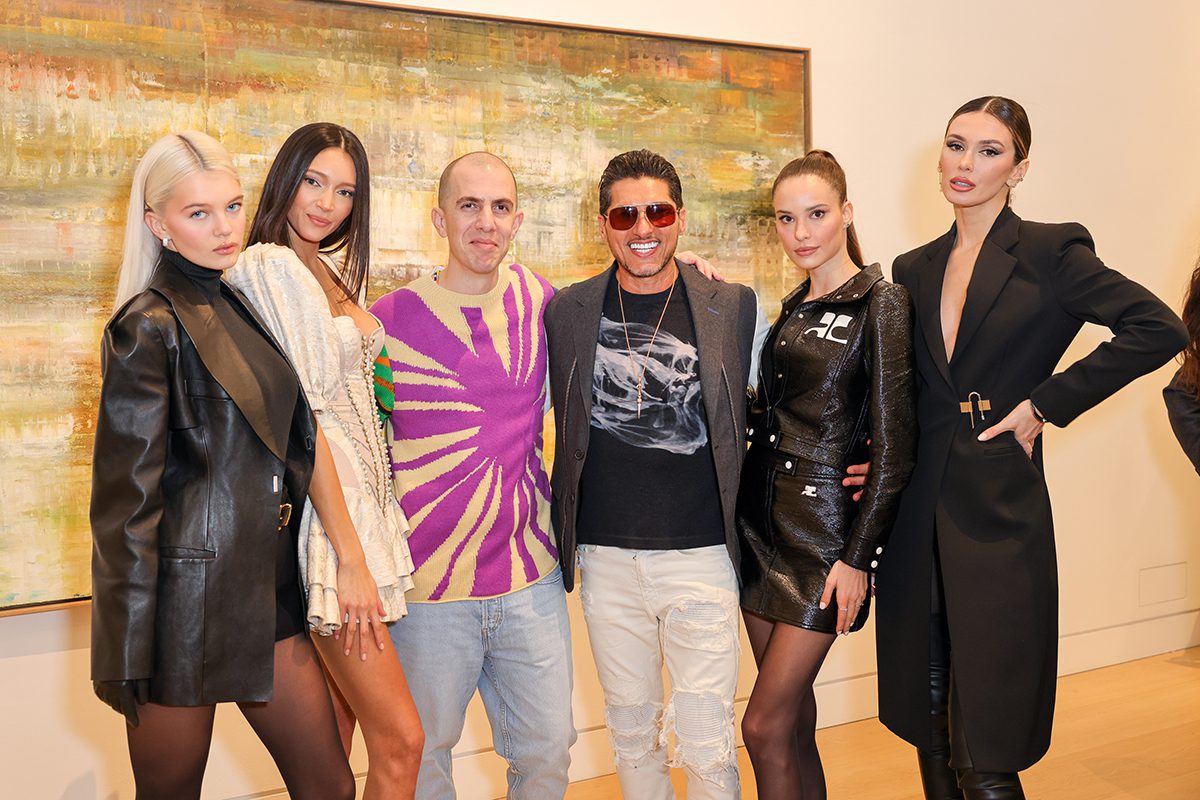 A group of men and women standing together for a photograph