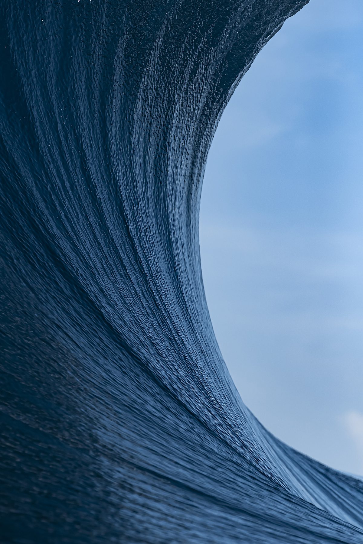 The curve of a wave and the blue sky
