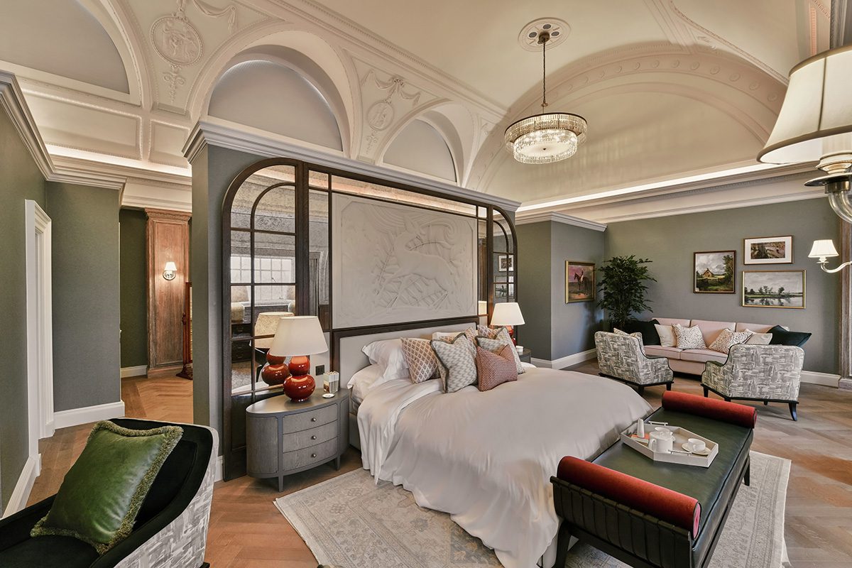 A bedroom in grey with hints of pink and red