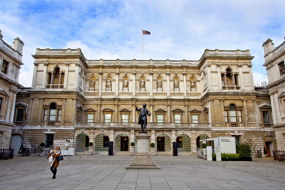An old style building with a Union Jack flag flying on the top of it 