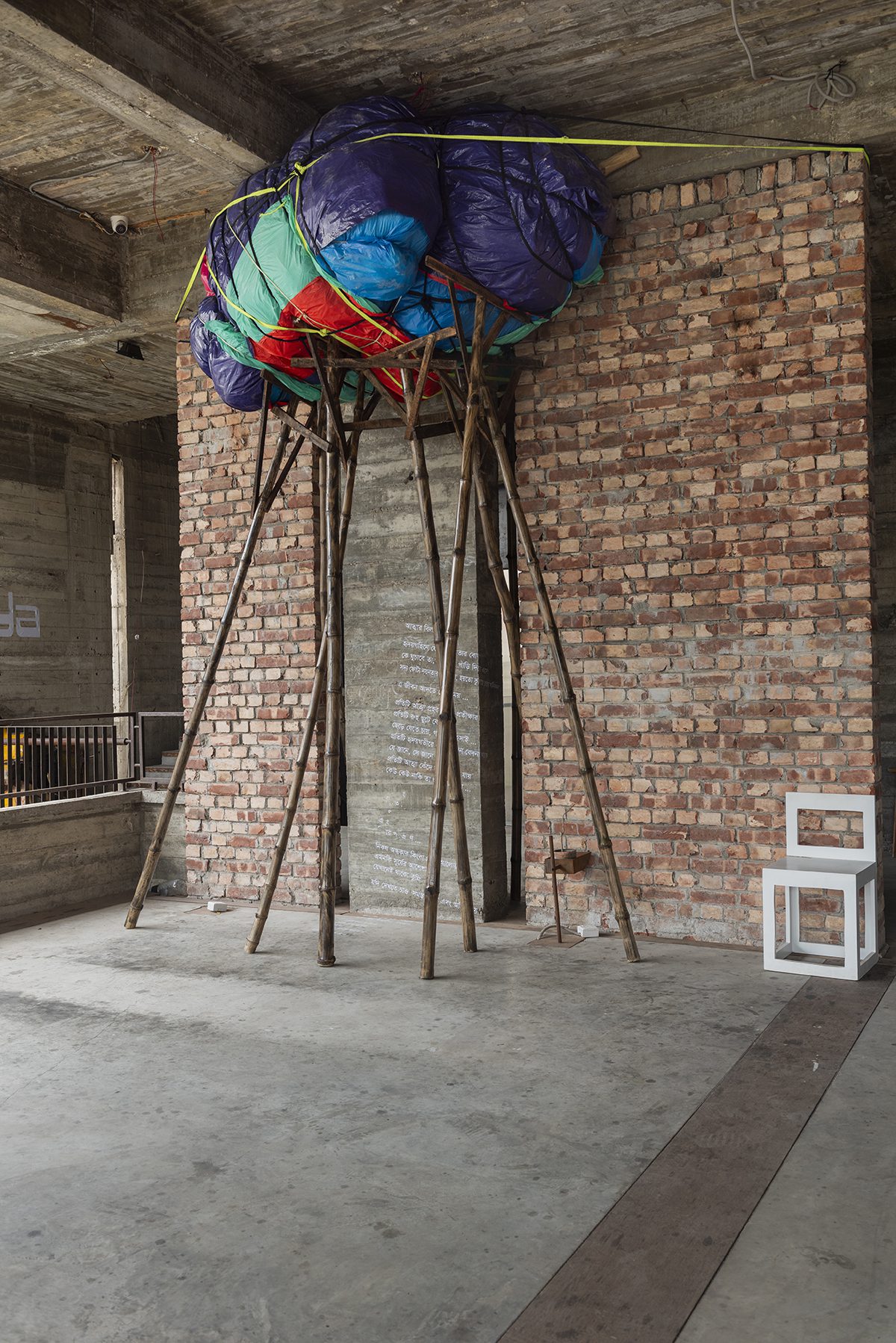 Bin bags on the ceiling held up by wooden sticks