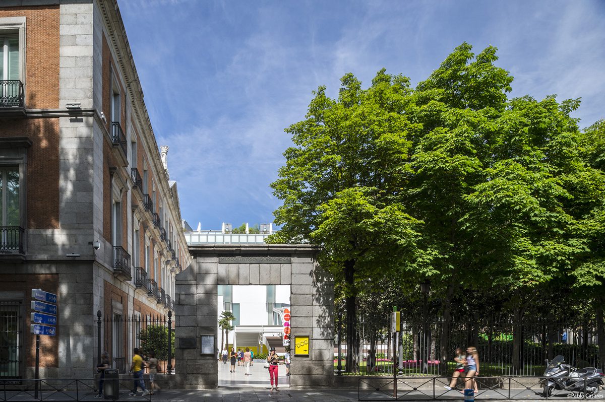 A building with a large tree on the side of it 