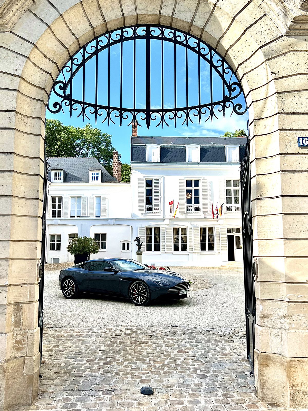 A car behind an arched gate