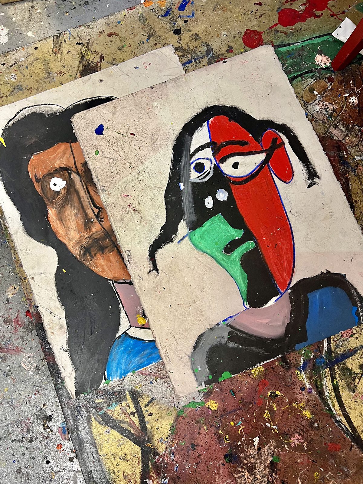 Paintings of colourful distorted faces