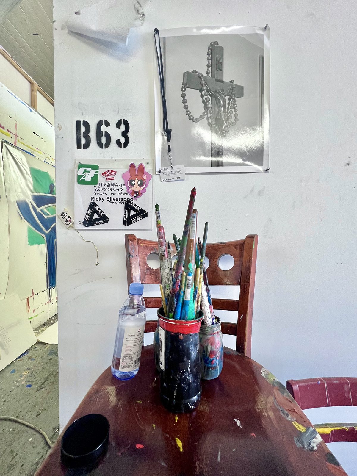pain brushes in a jar on a chair
