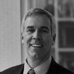 A man wearing a suit and tie