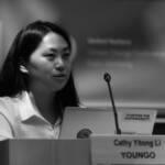 A woman giving a speech at a podium