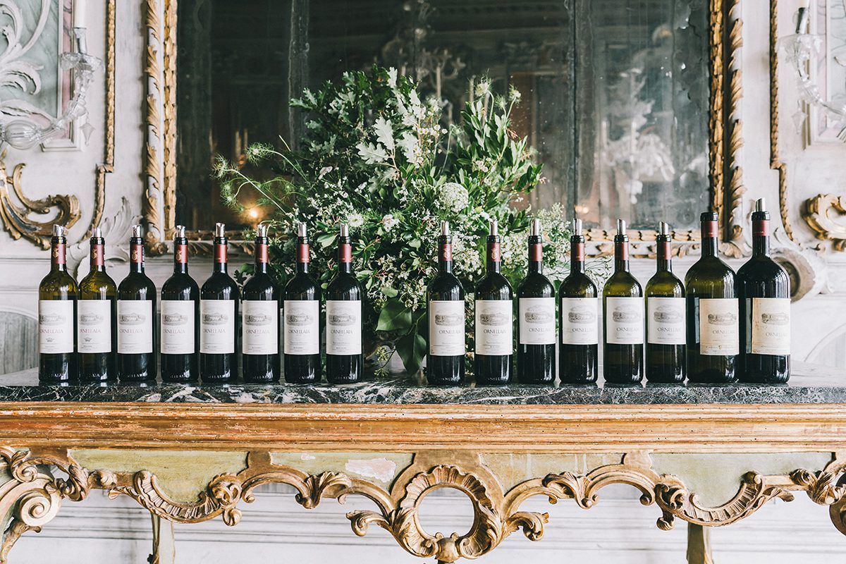 Wines side by side on a grand marble and gold mantlepiece 
