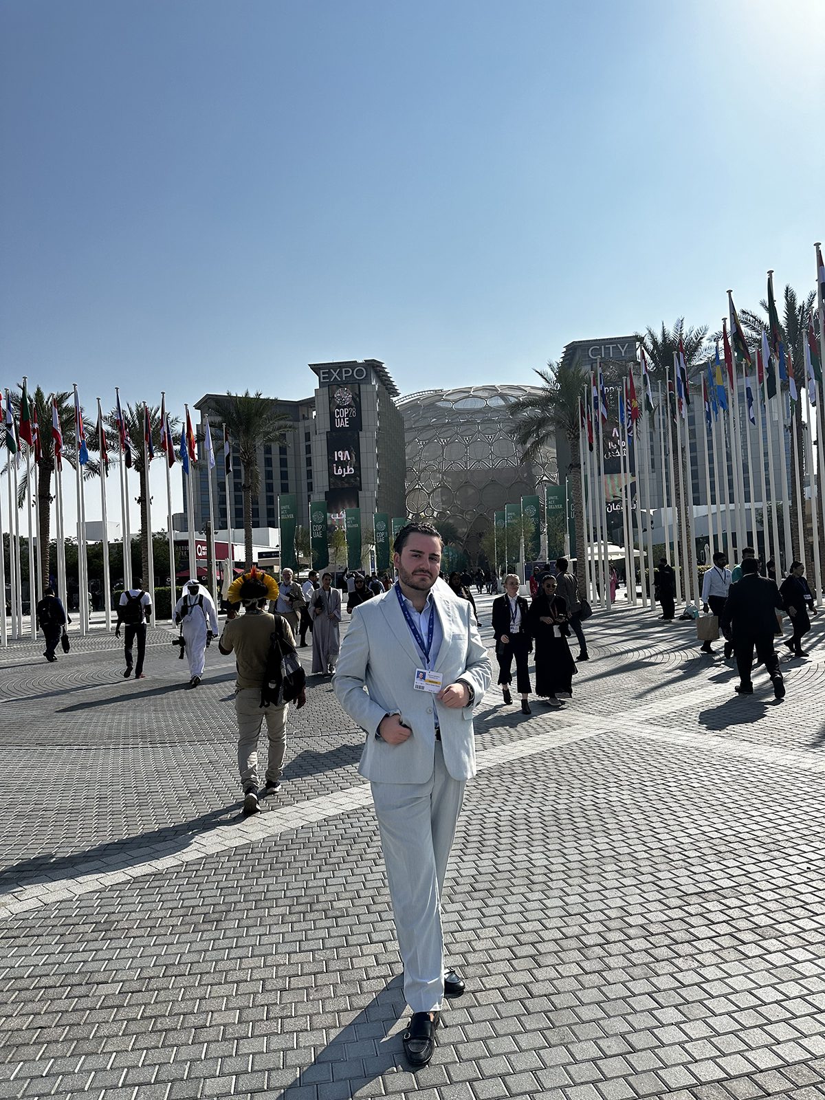 Man standing at a sunny conference