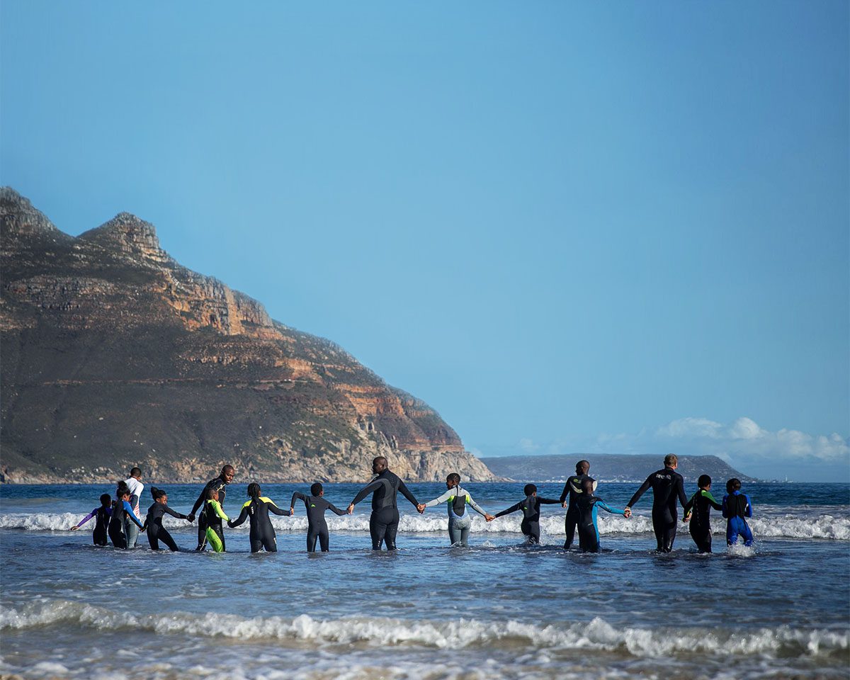 Children running into the sea