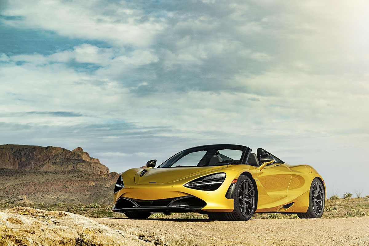 Gold sports car parked in the desert