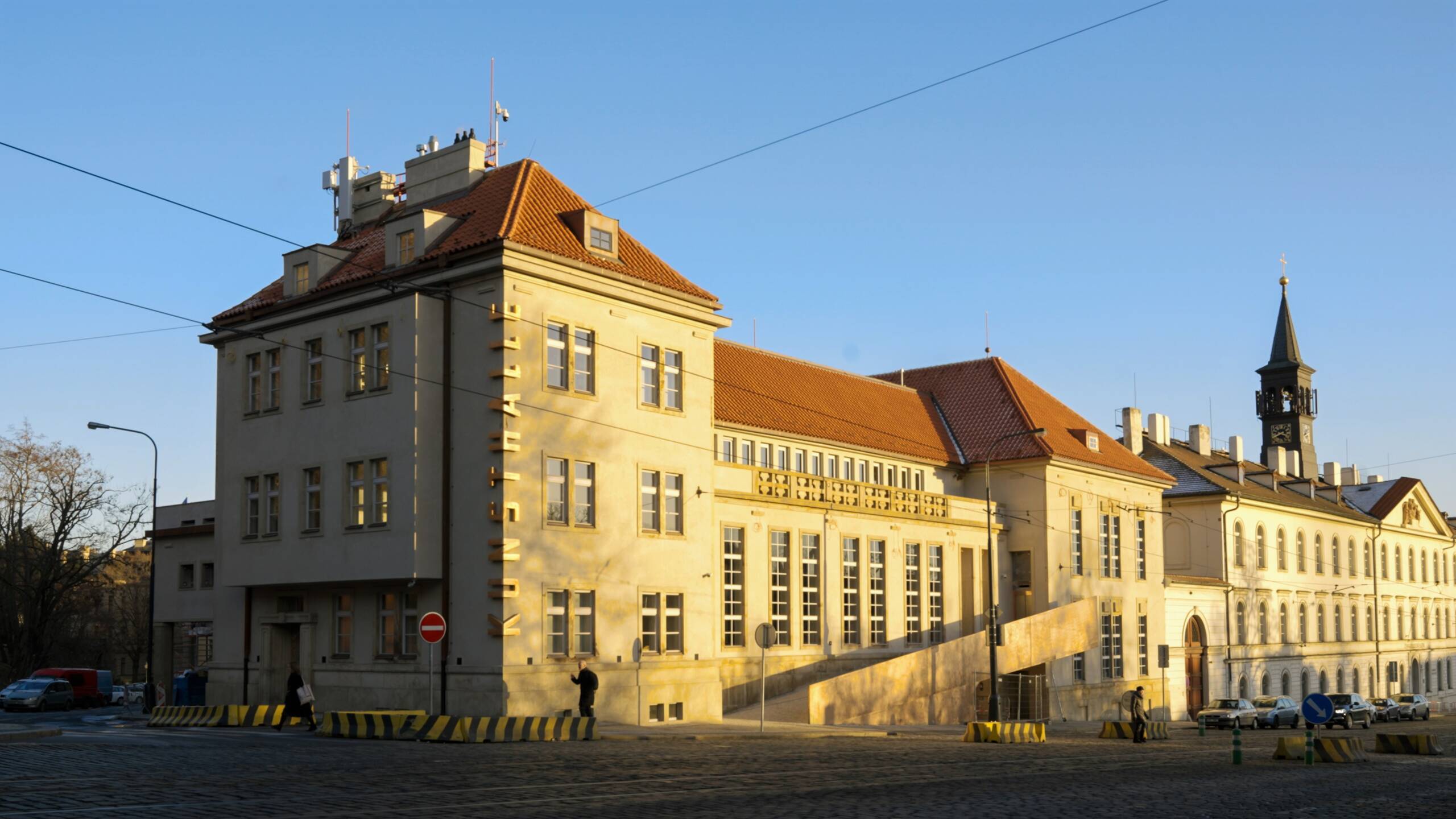 big building with orange roof in sunshine