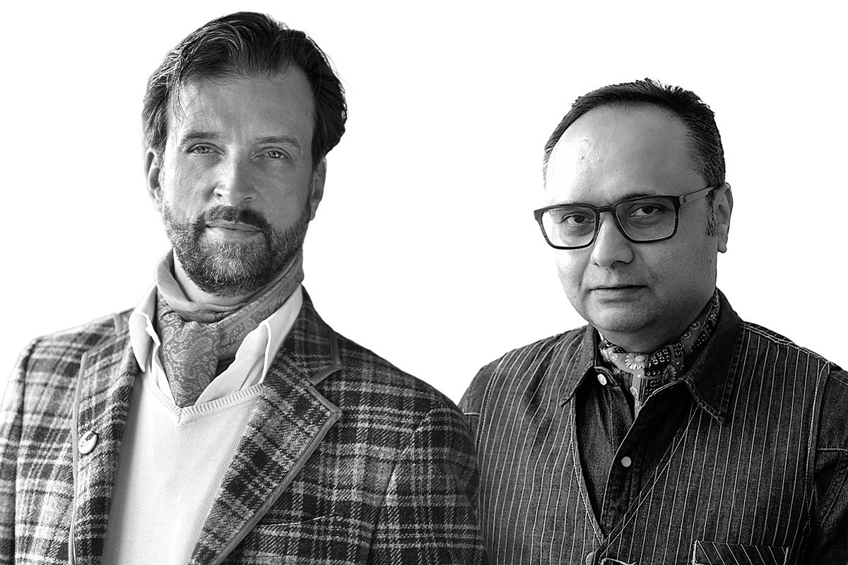 two men black and white standing next to each other