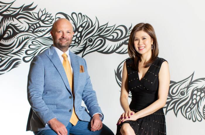 man and woman sitting next to each other