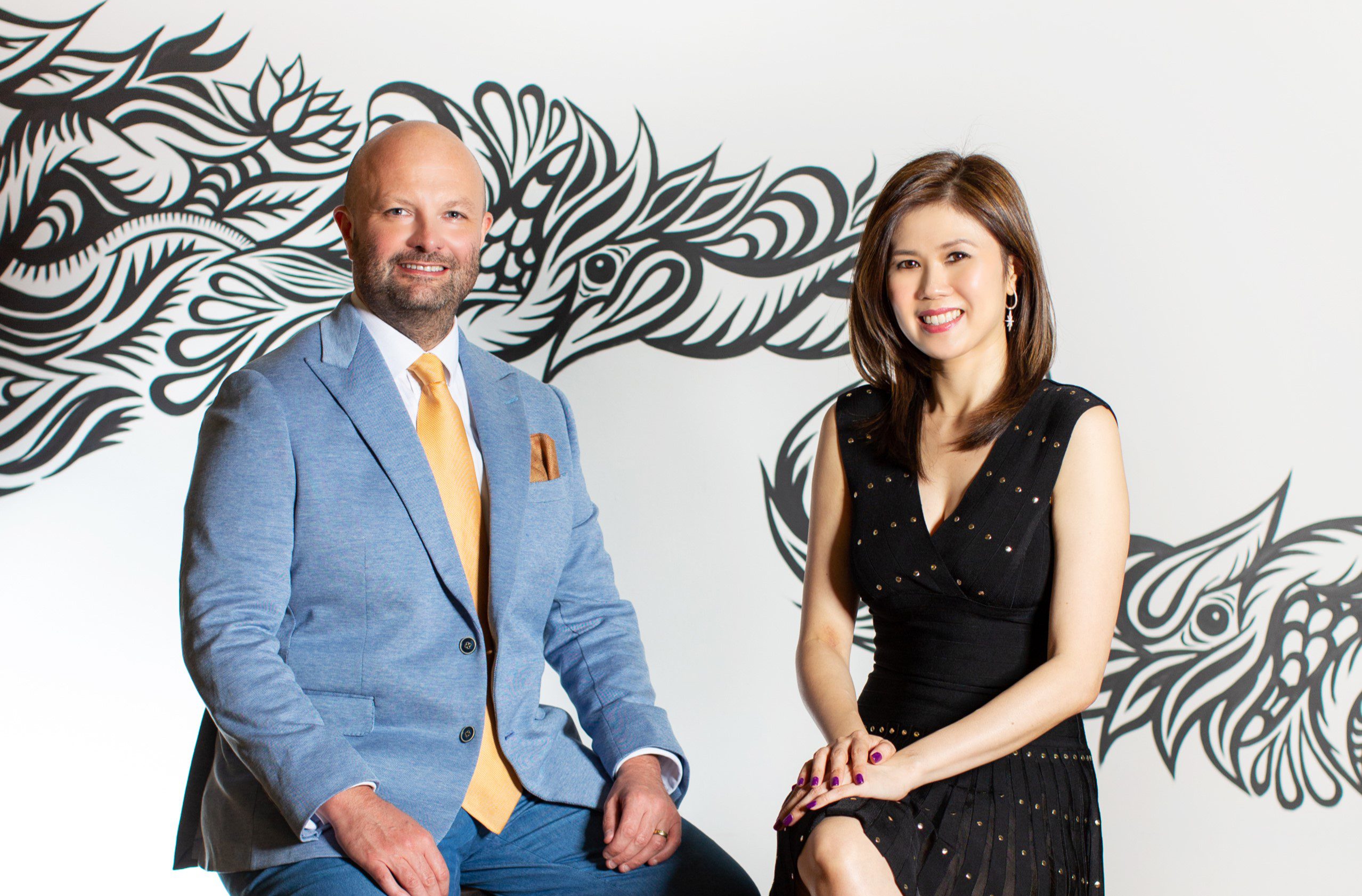 man and woman sitting next to each other