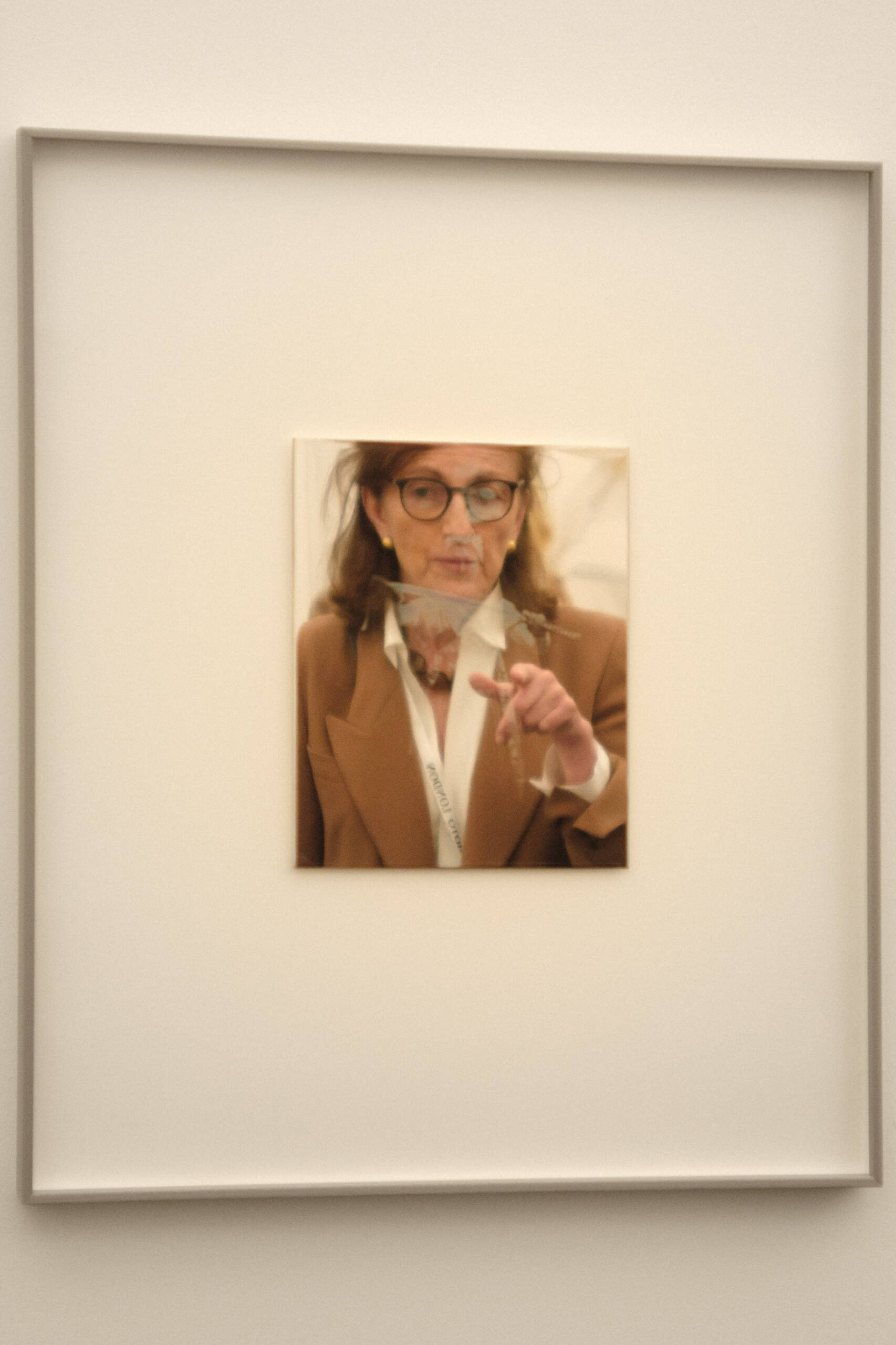 a woman in front of a daguerrotype image