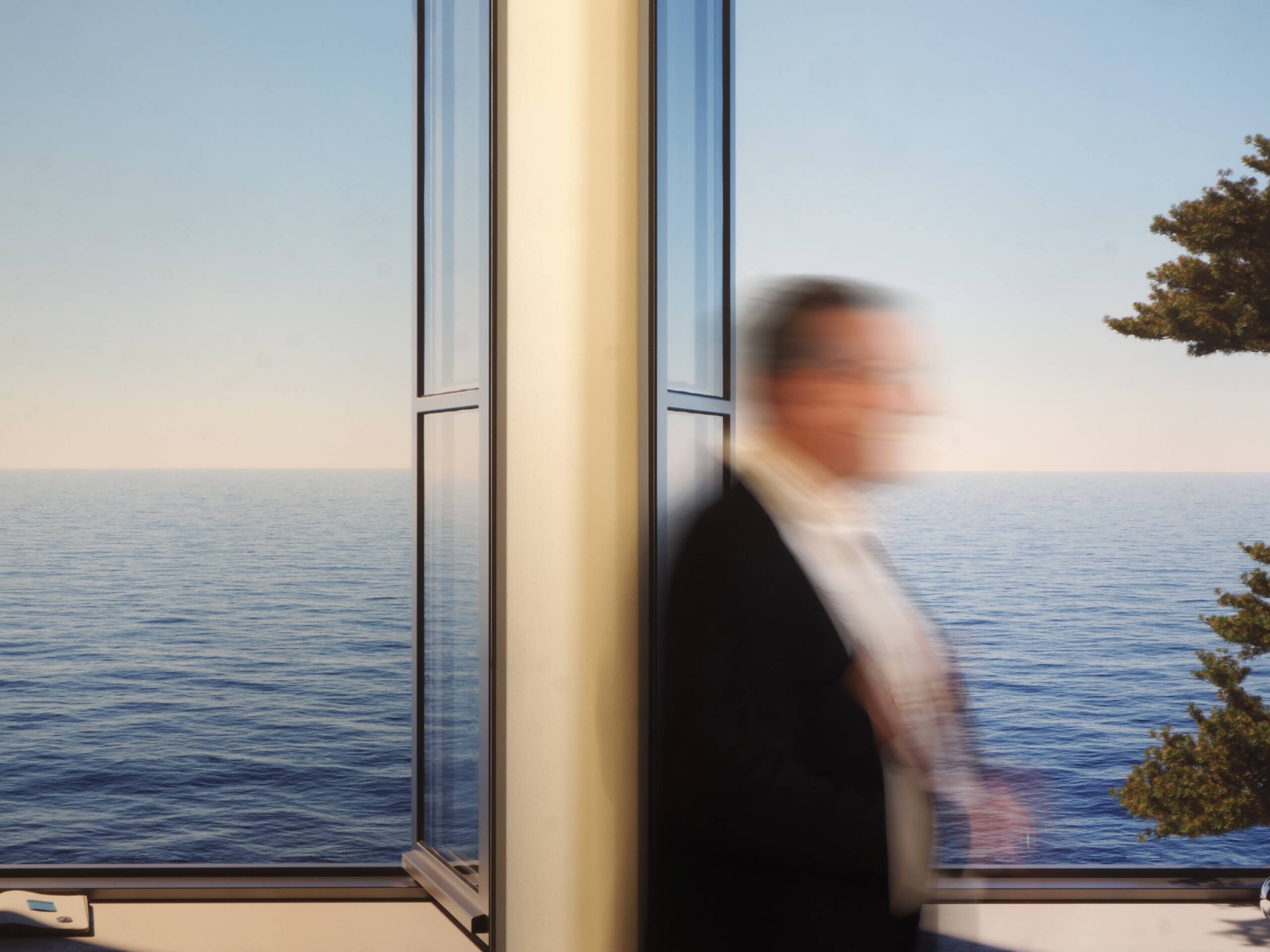 man in front of image in of the sea