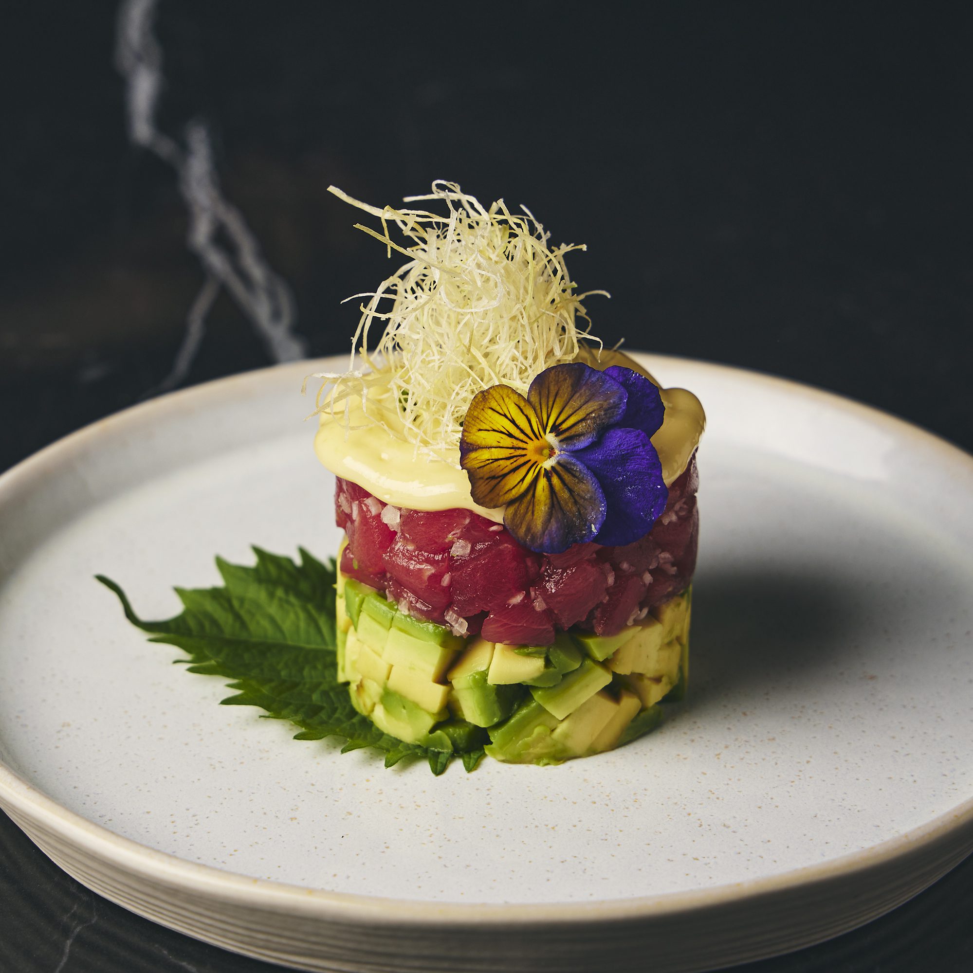 food on a plate with a leaf