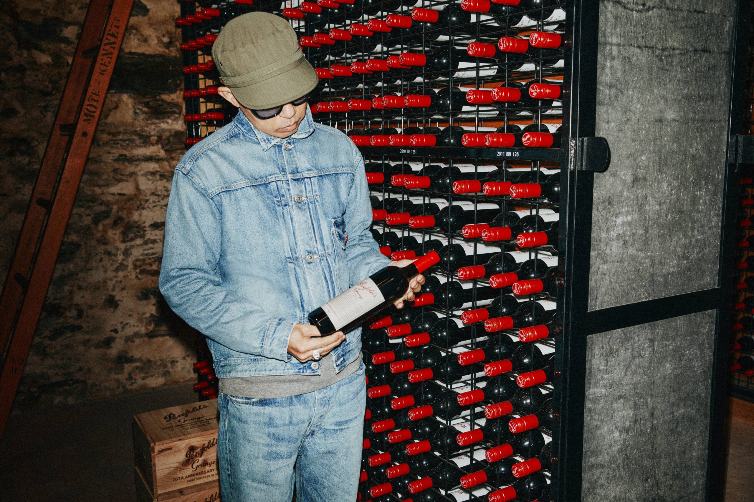 a man holding a bottle of wine